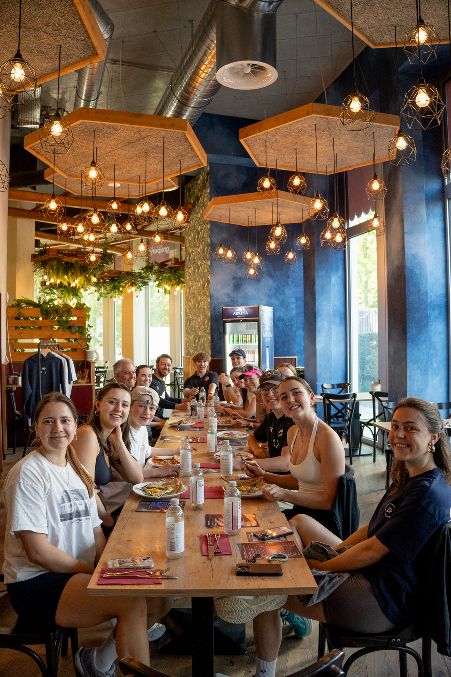 The Athlix community at a long table after the run